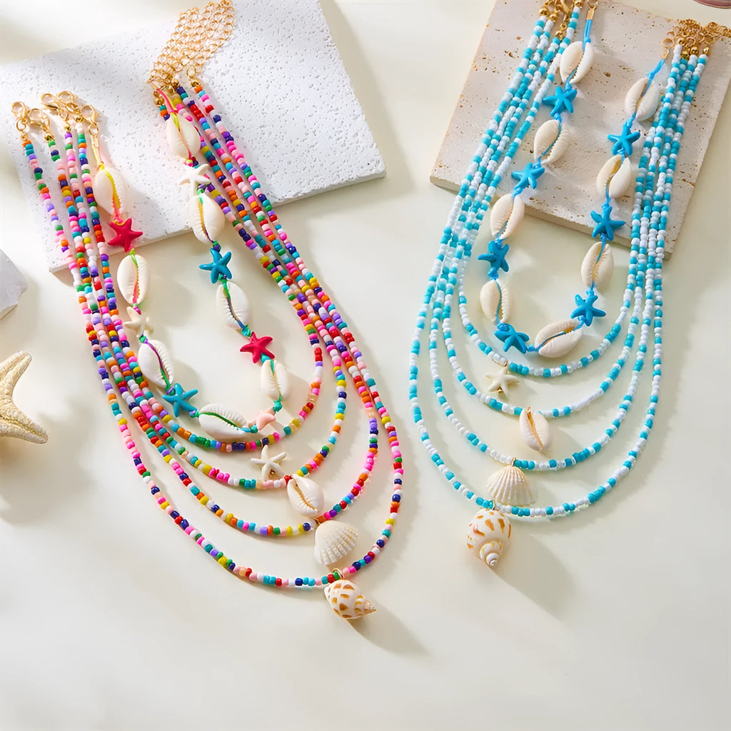 Five multi-layer shell bead necklaces with adjustable chains in blue and mixed colours