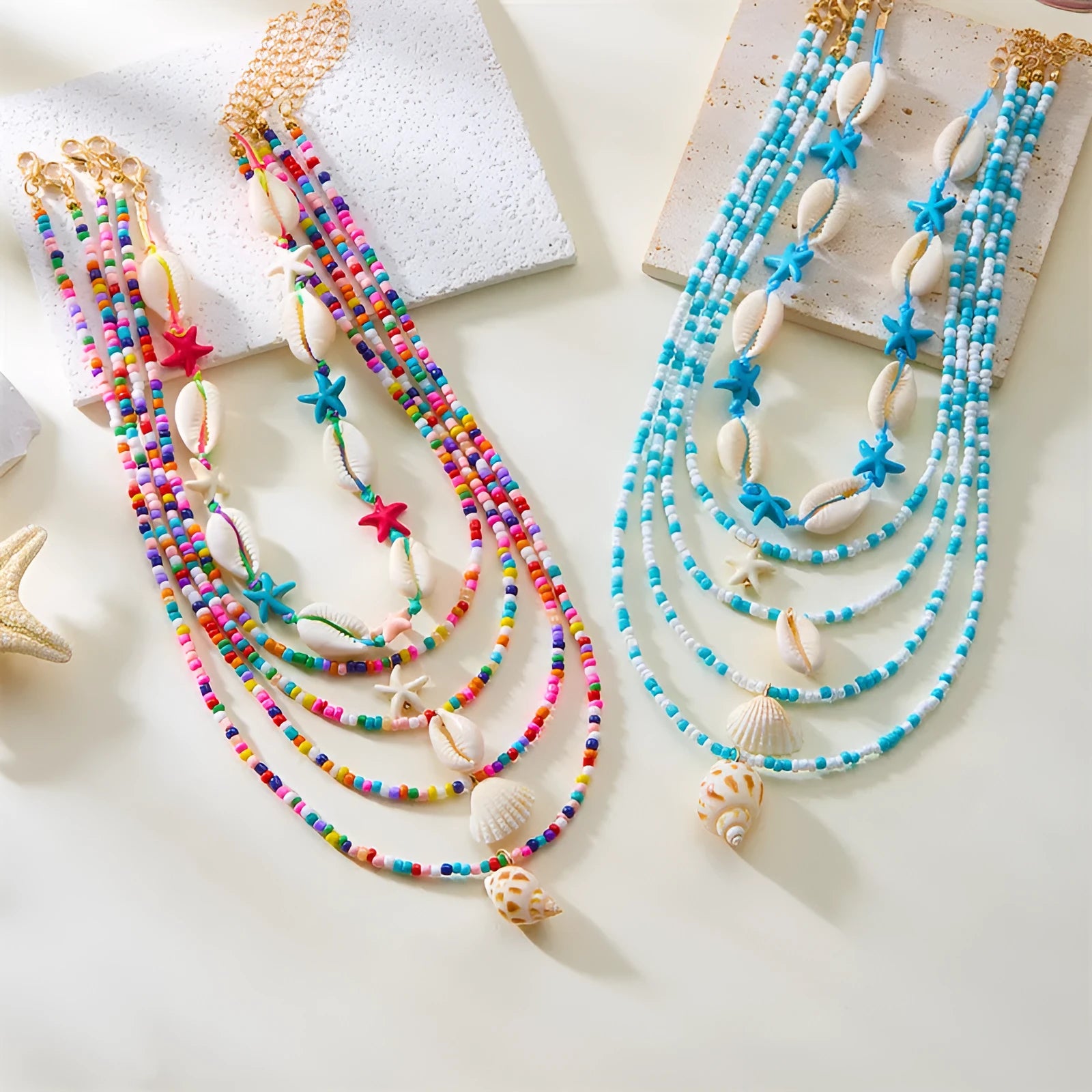 Five multi-layer shell bead necklaces with adjustable chains in blue and mixed colours