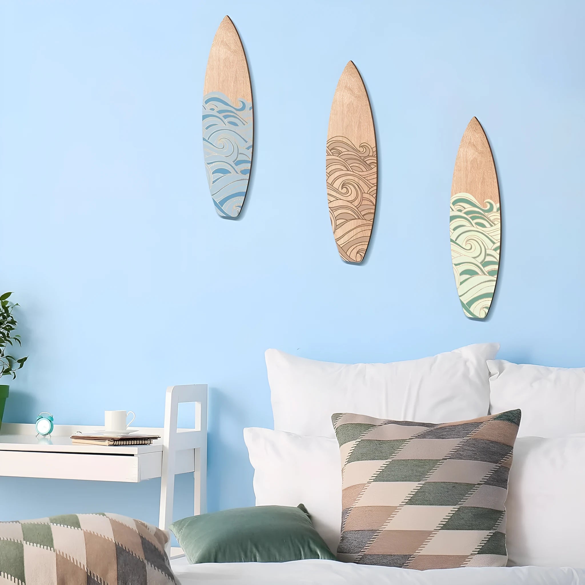 Three identical wooden surfboard-shaped wall decorations on a light background