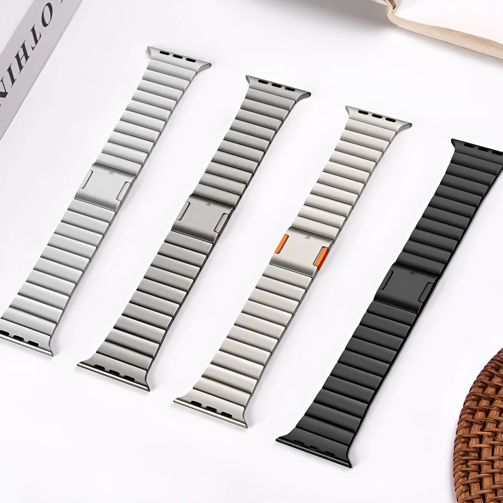 Silver stainless steel Apple Watch strap with magnetic buckle on a wrist, showing business style design.