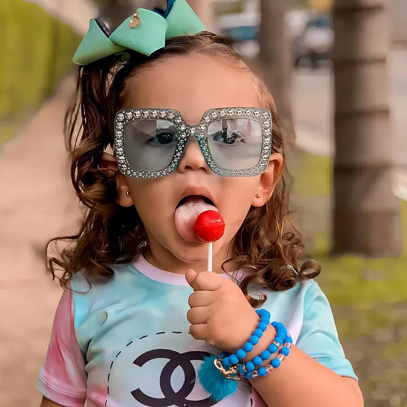 Plastic fashion sunglasses in multiple colour options including black, pink, and transparent frames