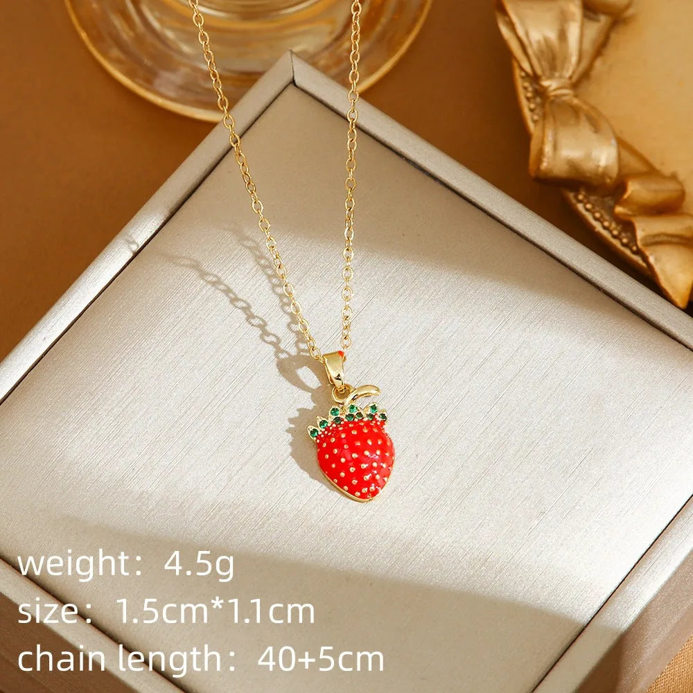 Titanium steel necklace with delicate fruit pendant on O-ring chain, available in golden and steel zircon finishes.