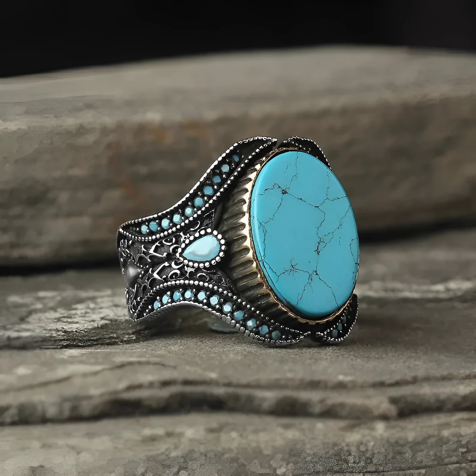 Round turquoise men's ring with antique silver alloy band showing stone detail and metallic finish