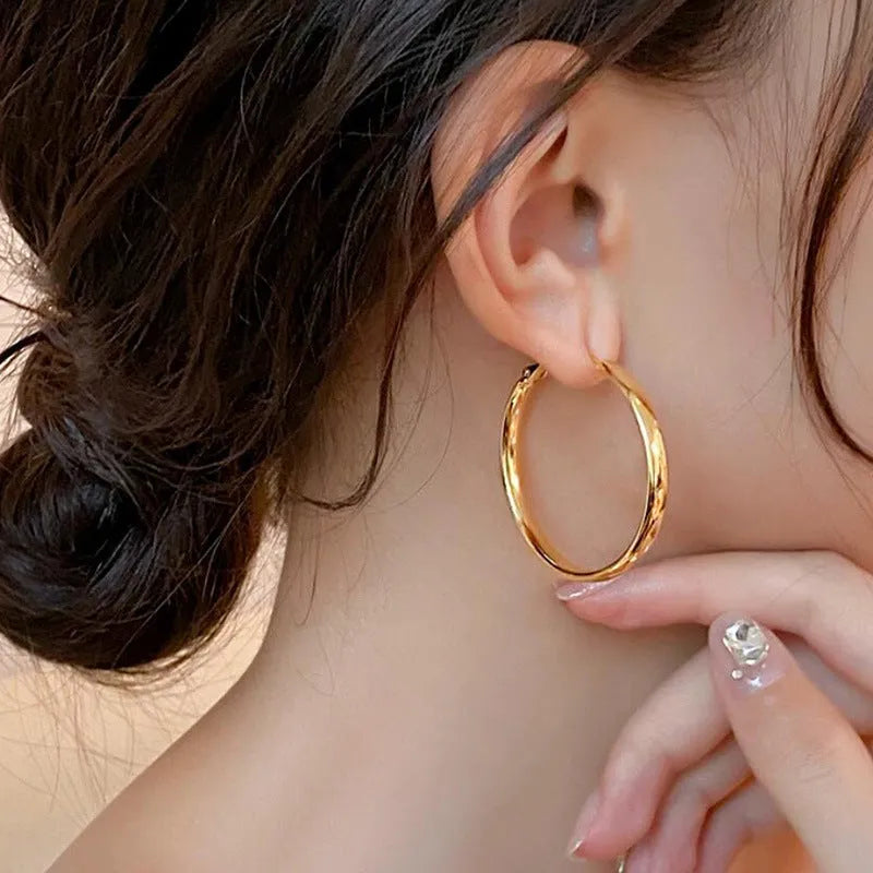 Large 40mm circular metal hoop earrings in gold or silver electroplated finish