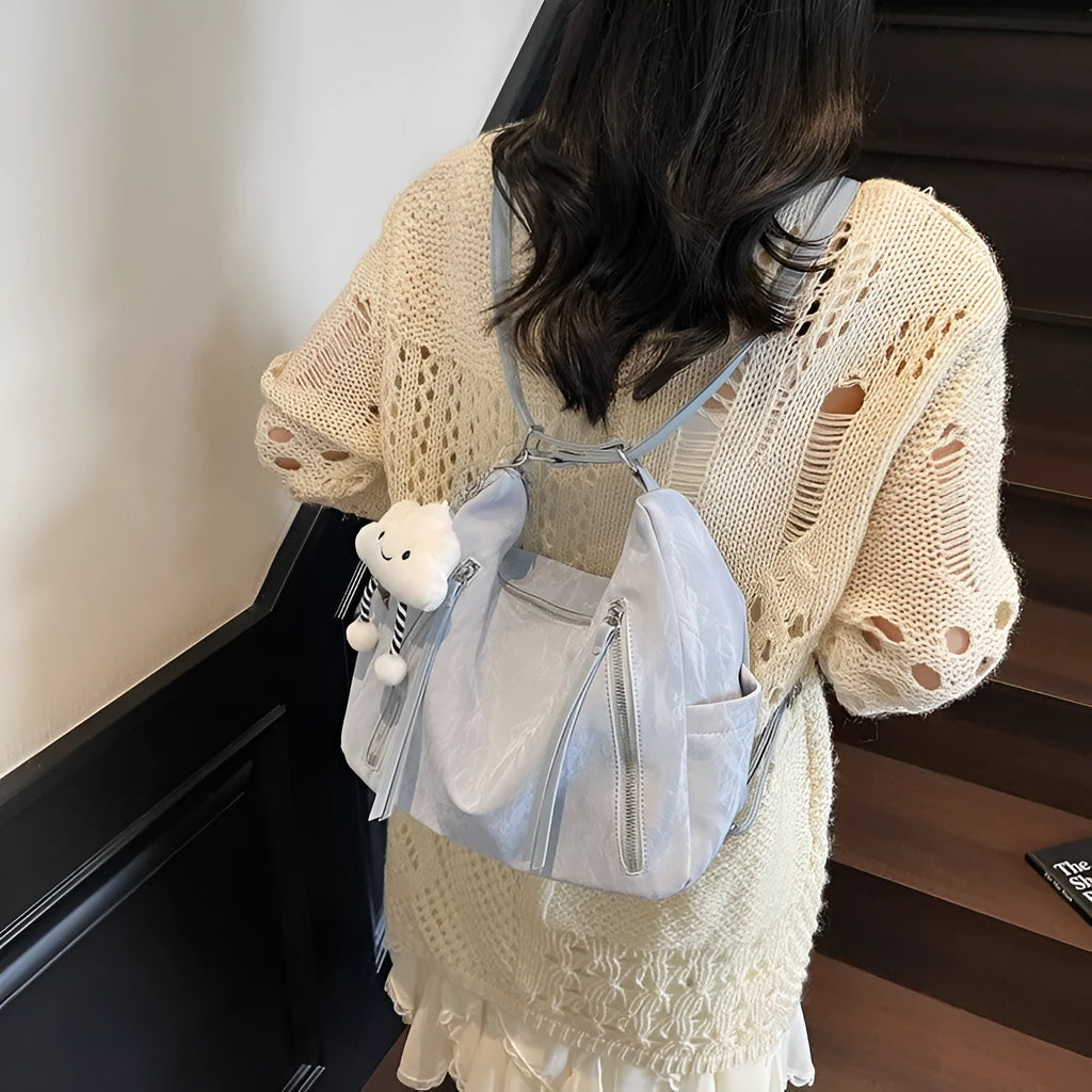 Women's soft PU leather fashion backpack in black colour with pendant accessory