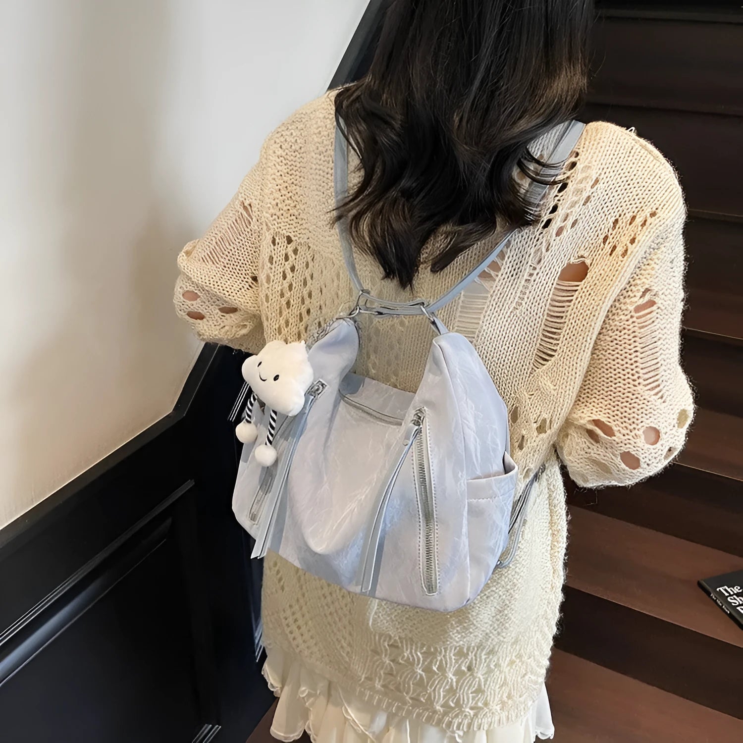 Women's soft PU leather fashion backpack in black colour with pendant accessory
