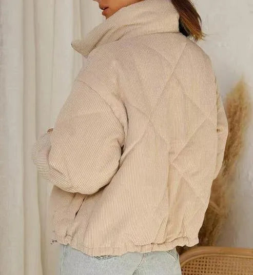 Women's apricot-coloured corduroy jacket with a stand collar and front zipper, laid flat.