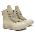 Black high-top leather unisex sneakers with a side zipper on a white background.