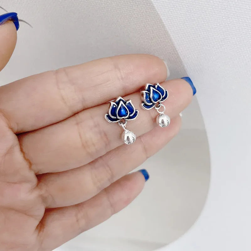 Blue lotus seedpod earrings with artistic tassel detailing on flower-shaped 1.2cm studs