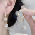 Silver coloured women's earrings with tassel ball and rhinestone ball pendants on ear clips