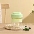 Green plastic salad cup with sealing lid and built-in spoon, 480ml capacity