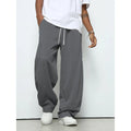 Men's straight-leg casual trousers in polyester with an elasticated waist, shown in black, grey and light grey.
