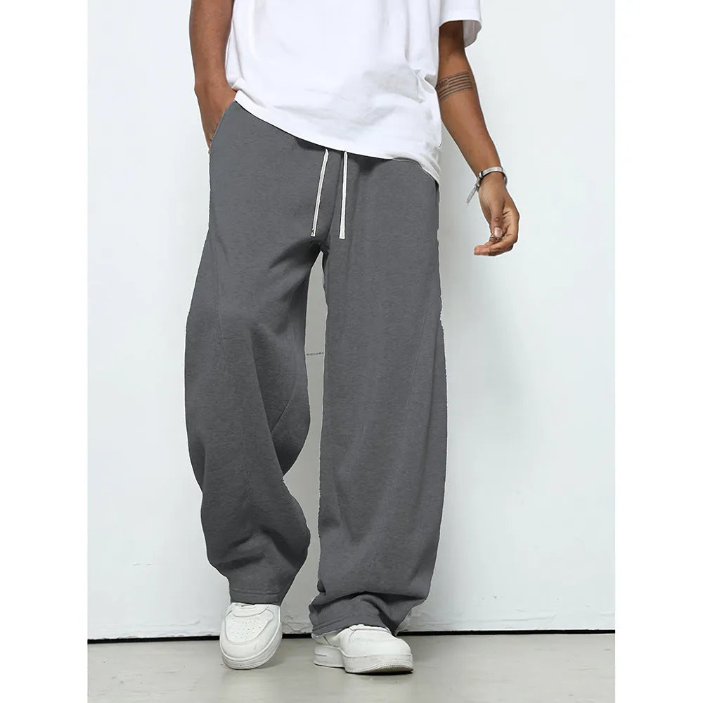Men's straight-leg casual trousers in polyester with an elasticated waist, shown in black, grey and light grey.