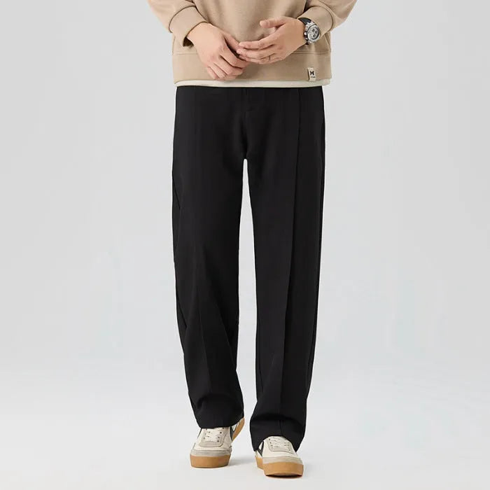 Men's casual loose straight-leg pants in solid colour with mid-high elastic waist and button fly front, available in plus sizes