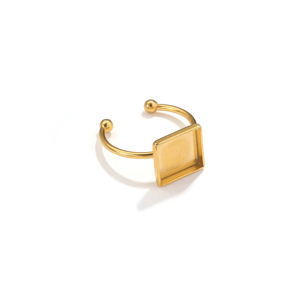 Golden stainless steel ring settings in various shapes including oval, round, square, rectangle, and heart designs