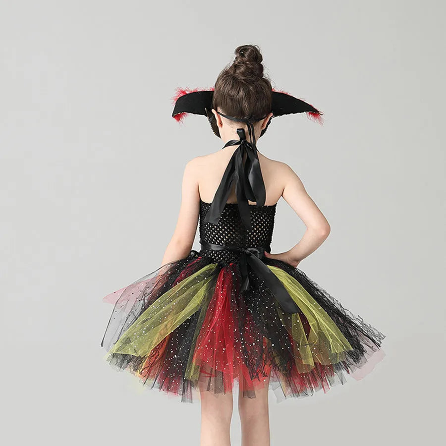 A sleeveless girls pirate dress costume with sequin and mesh decoration, shown with an optional black eye mask.