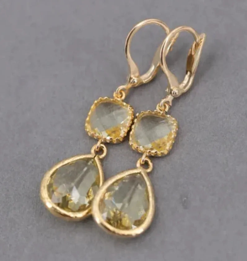 Gold geometric long fringe drop earrings with water droplet crystal decorations on copper material