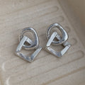 Retro geometric circle pendant earrings in gold or silver finish, measuring 3.4cm in height.