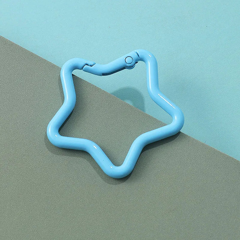 Zinc alloy five-pointed star keychain in light pink, one of ten available macaron colours.