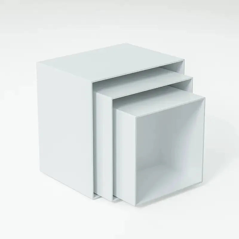 Set of six white plastic cube units forming a tiered desktop dessert display stand.