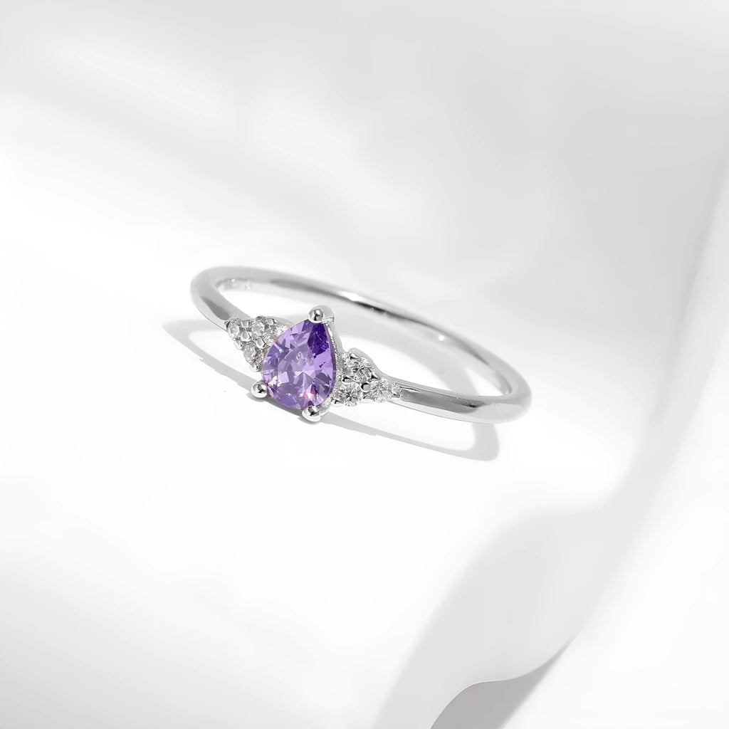 S925 sterling silver ring with purple crystal drop-shaped rhinestone on white background