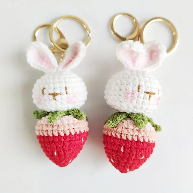 Hand-woven white wire pendant with rabbit strawberry pattern and attached key