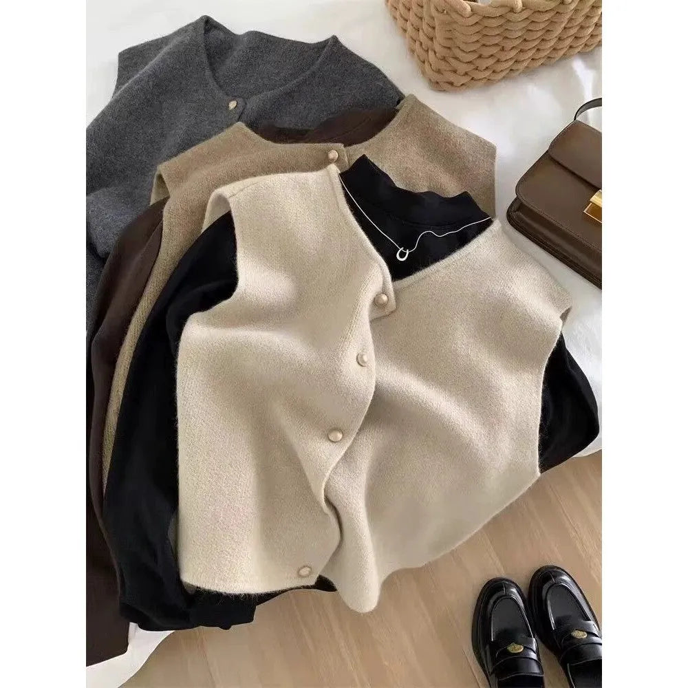 Women's thin polyester pullover vest with half sleeves in a choice of six colours on a hanger.