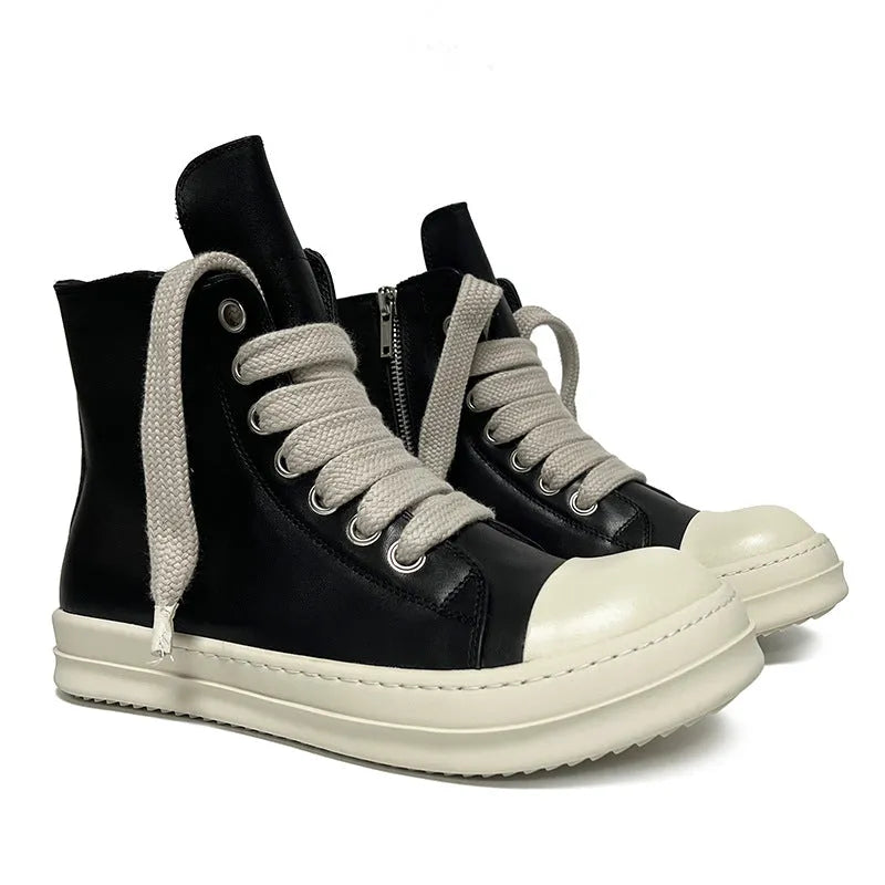 Black high-top leather unisex sneakers with a side zipper on a white background.