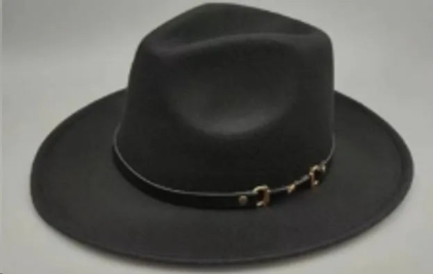 Brown leather velvet Western cowboy hat with a curved edge brim and conical crown.