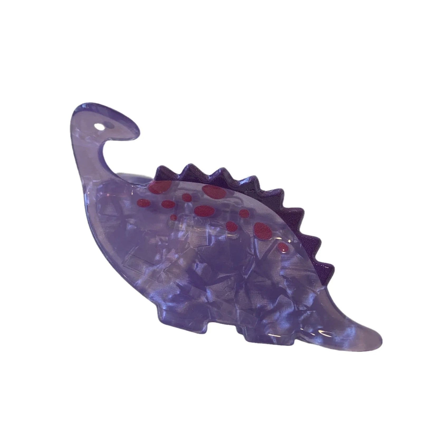 Dinosaur-themed acrylic jaw hair clip showing six colour variations with grip mechanism