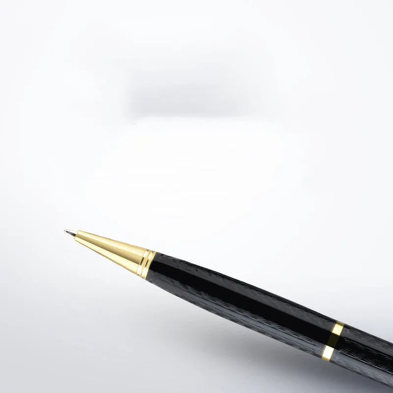 Black pen-shaped zinc alloy voice recorder shown with headset and data cable.