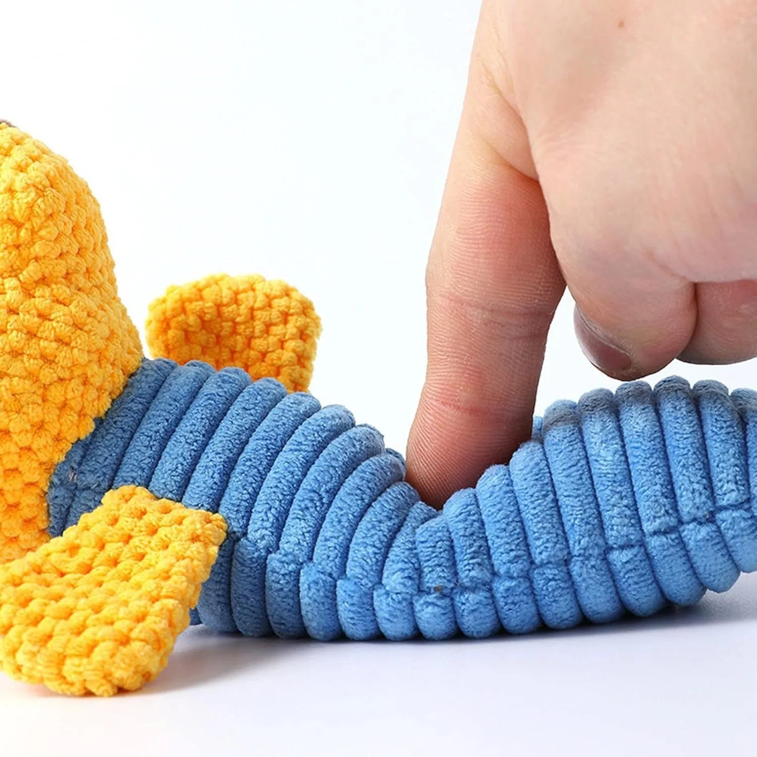 Squeaky stuffed animal dog chew toy measuring 19cm by 5cm for dental cleaning