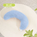 Blue U-shaped cat pillow with an adjustable fabric collar on a grey sofa.
