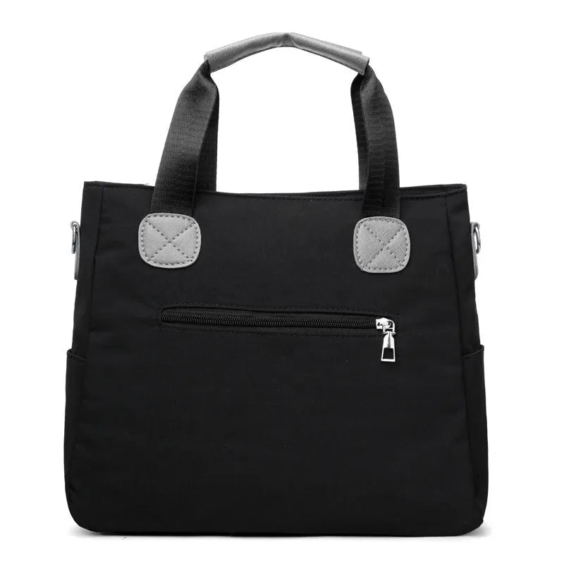 Women's nylon large-capacity crossbody bag in black with organised compartments and single shoulder strap