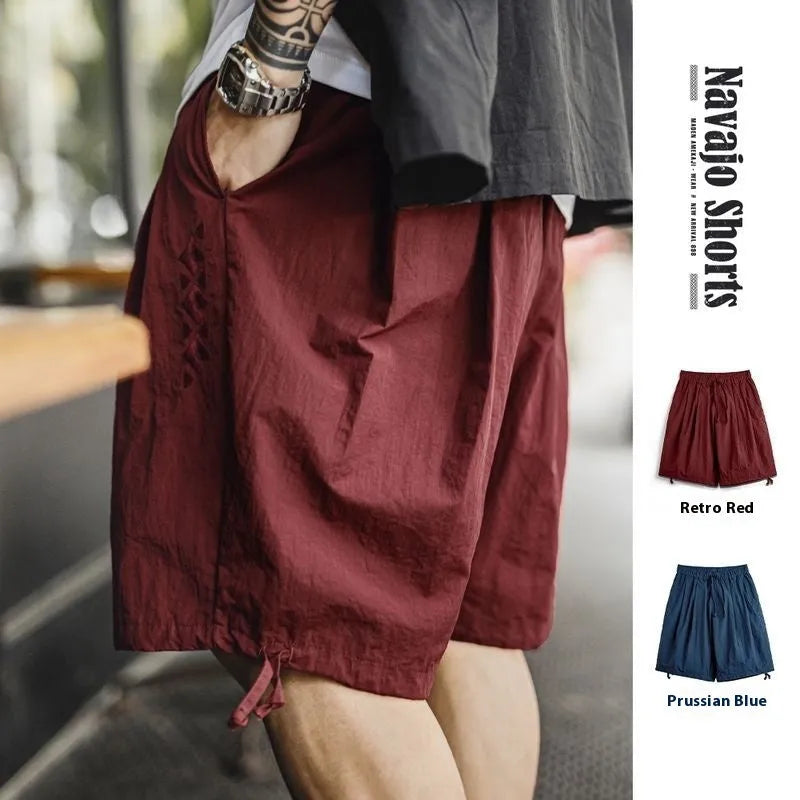 Men's embroidered loose fit beach shorts in Prussian blue colour, lightweight nylon fabric