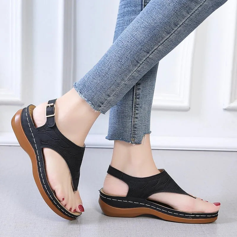 Women's casual wedge heel flip flop sandals with adjustable back strap in red vegan leather