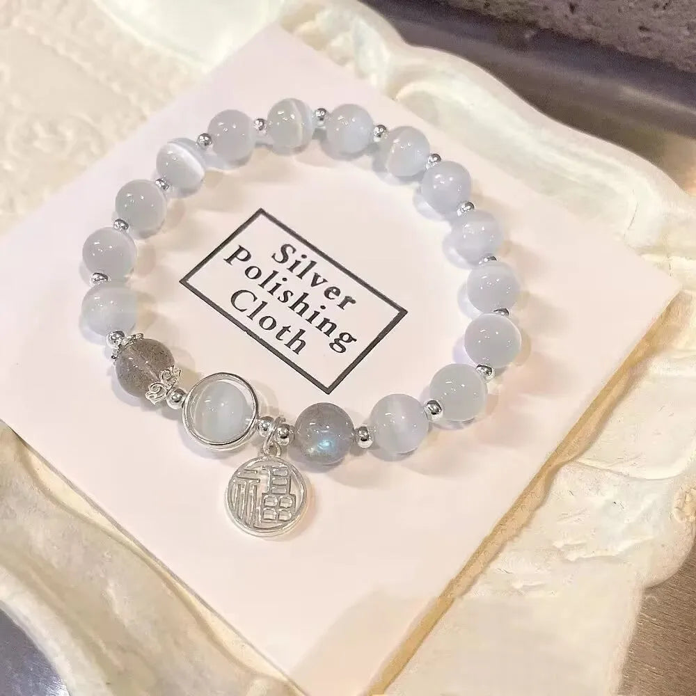 Handmade glass butterfly bracelet in moonlight grey with drop shape design and coloured glass beads