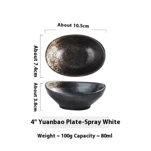 Oval Japanese ceramic sauce dipping bowl with traditional underglaze pattern on a wooden table.