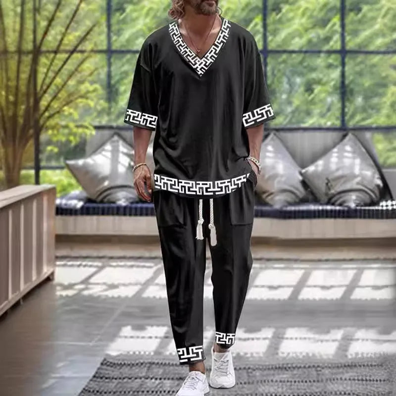 Cropped sleeve V-neck jacket and matching trousers in polyester fabric
