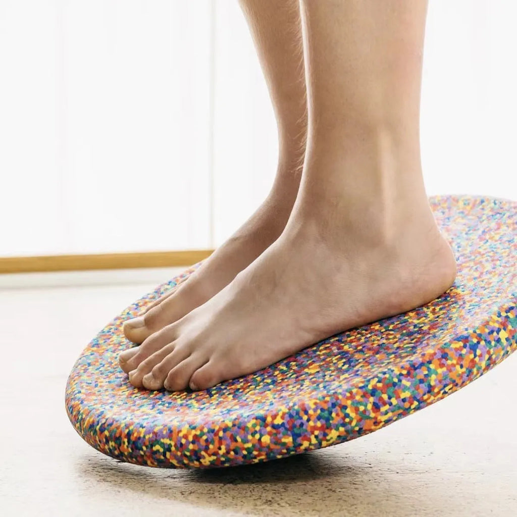 Plastic wood surf balance board for children, shown in mixed colour and black wood grain finishes.