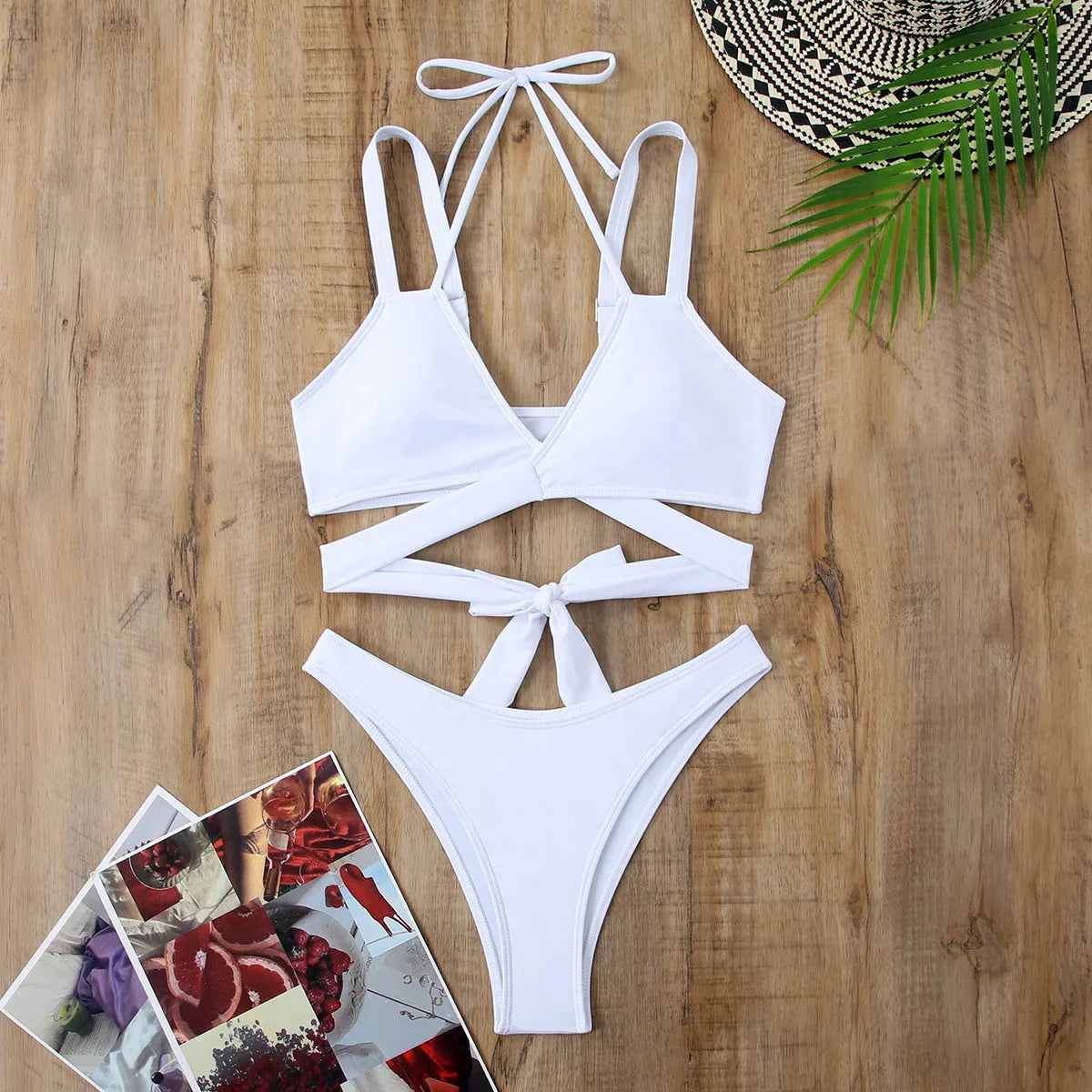 Women's solid colour strap bikini swimsuit in brief style on a hanger.