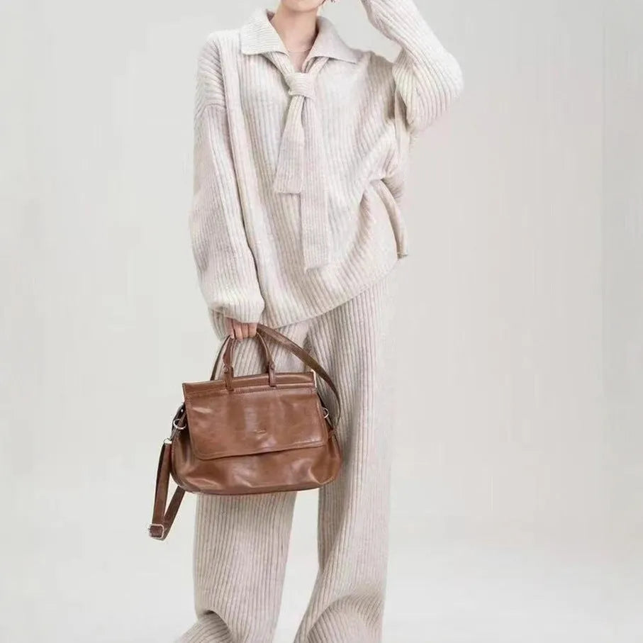 Beige imitation cashmere sweater suit two-piece set with knit top and trousers on a hanger