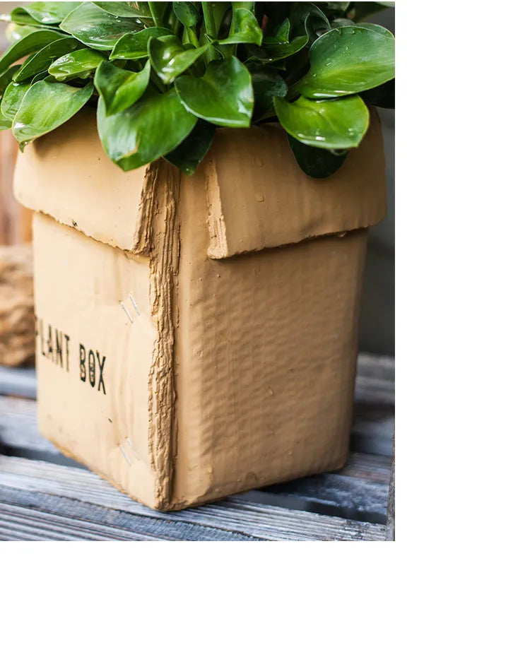 Cement flowerpot with bottom drainage holes and paper box texture in Nordic style design