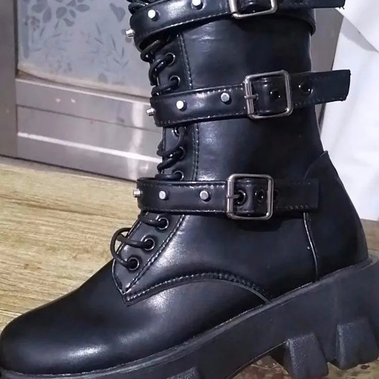 Black women's mid-calf buckle boots with side zip and round toe on a white background.