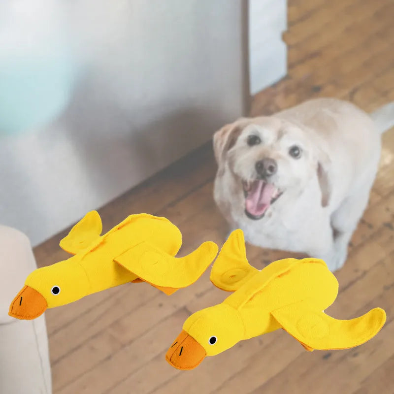 Yellow teddy bear shaped dog toy with food leak compartment and squeaker for training and enrichment