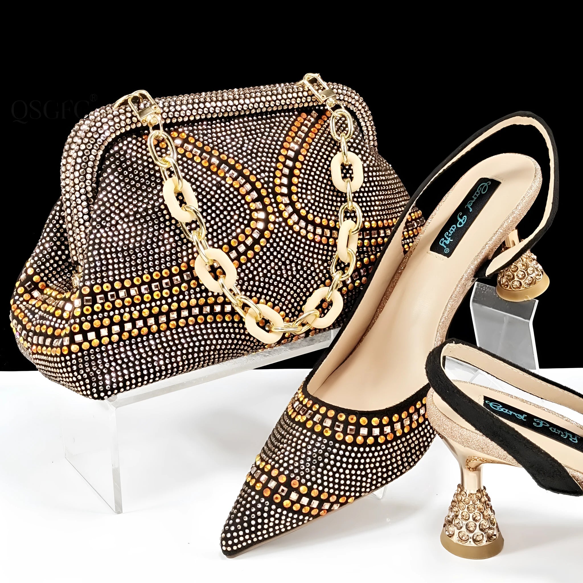 Women's pointed toe high heel court shoes with rhinestone detail and a matching small bag.