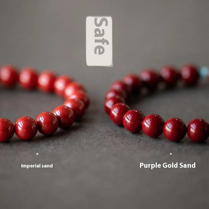 Geometric cinnabar and Hetian jade bead bracelet in purple gold sand colour on a wrist.
