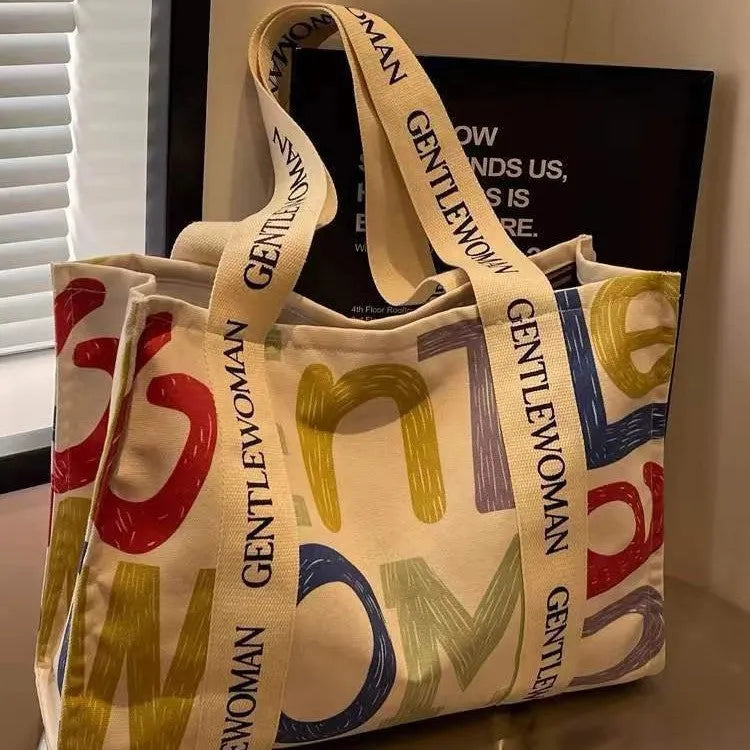 A large canvas tote bag with a printed design, shown in a choice of styles.