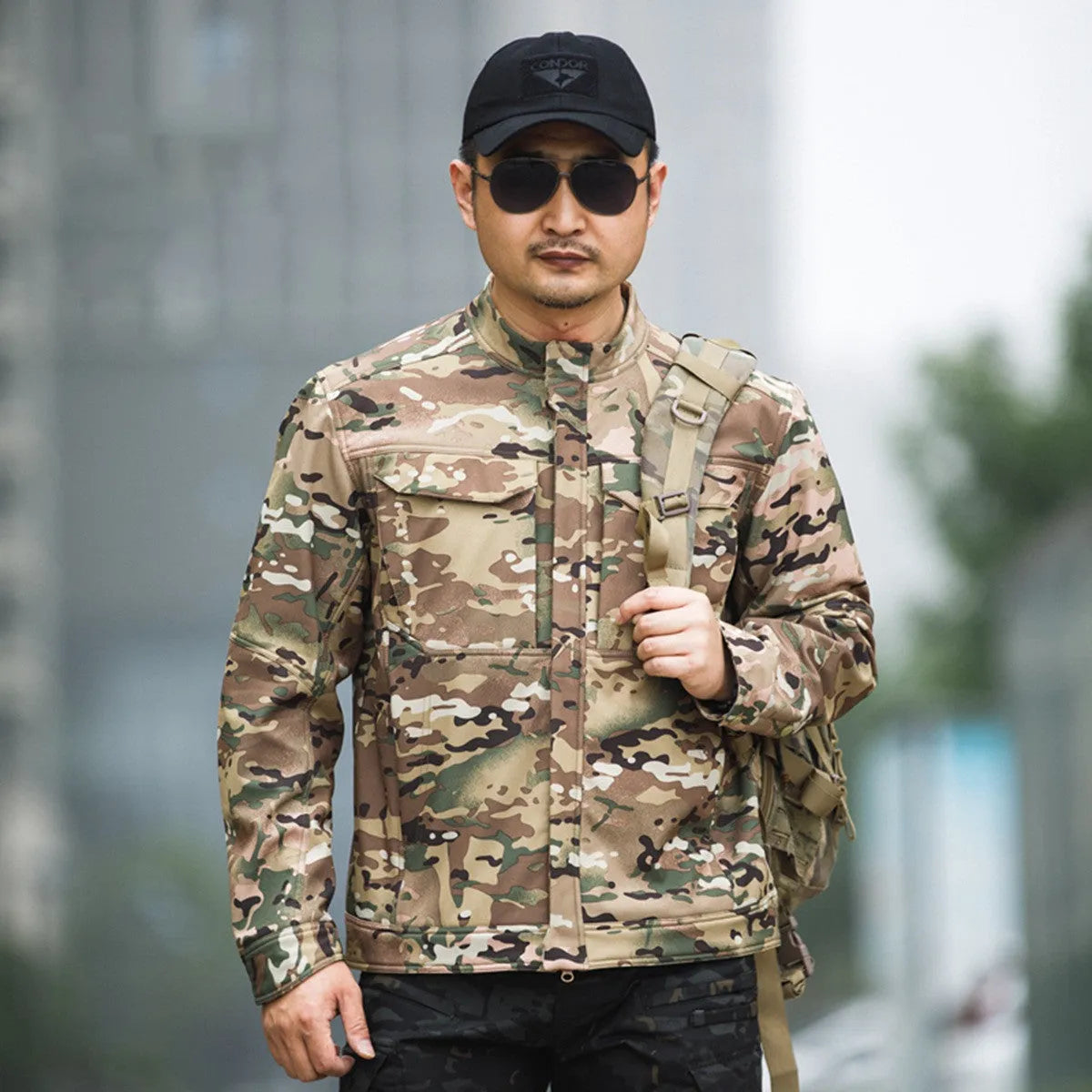Bone Frog Peak Breaker soft shell tactical jacket in black, shown in outdoor setting.