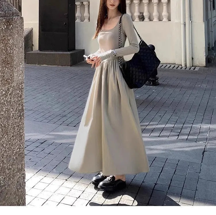Women's black knitted dress with square collar, long sleeves, elastic waist, and A-line long skirt